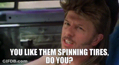 A Man Is Sitting In A Car With The Words `` You Like Them Spinning Tires , Do You ? '' On The Screen . GIF