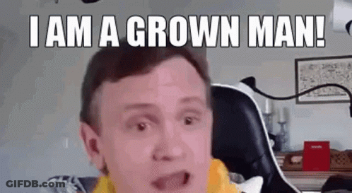 A Man Is Sitting In A Chair And Making A Funny Face While Saying `` I Am A Grown Man ! '' GIF