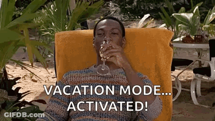 A Man Is Sitting In A Chair Drinking A Glass Of Wine And Says `` Vacation Mode ... Activated ! '' GIF