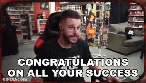 A Man Is Sitting In A Chair In A Room With The Words `` Congratulations On All Your Success '' . GIF