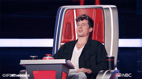 A Man Is Sitting In A Chair With A Nbc Logo On The Bottom GIF