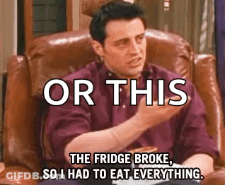 A Man Is Sitting In A Chair With A Pizza And A Fridge Broke . GIF