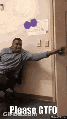 A Man Is Sitting In A Chair With His Arm Outstretched And The Words Please Gtfo On The Bottom GIF