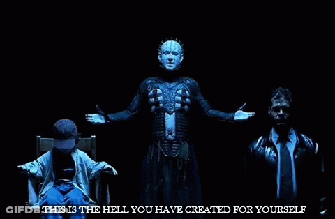 A Man Is Sitting In A Chair With His Arms Outstretched In Front Of A Man In A Suit And Tie . GIF