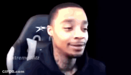 A Man Is Sitting In A Chair With His Eyes Closed . GIF