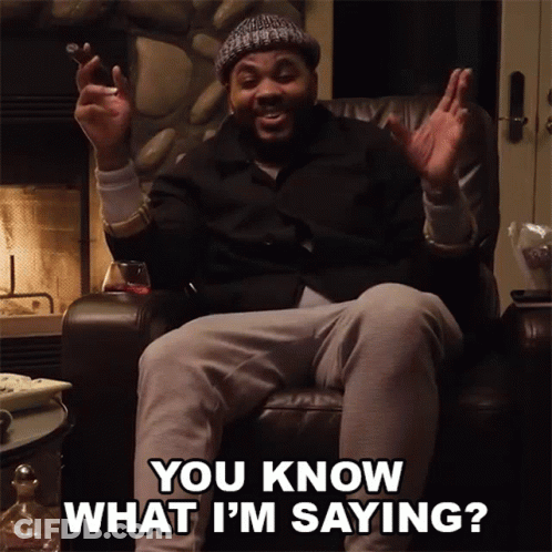 A Man Is Sitting In A Chair With His Hands In The Air And Says You Know What I 'M Saying GIF
