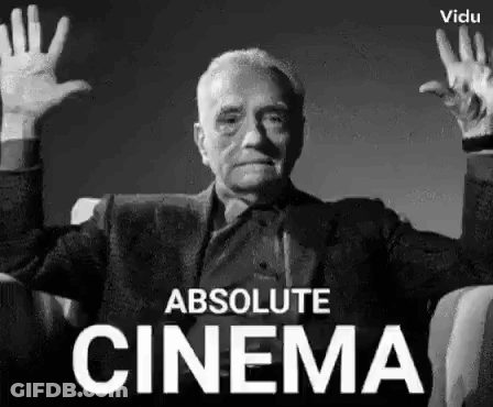 A Man Is Sitting In A Chair With His Hands Up In The Air . GIF