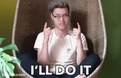 A Man Is Sitting In A Chair With His Legs Crossed And Giving A Thumbs Up Sign . GIF