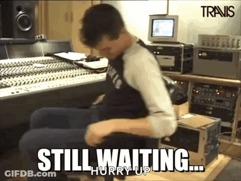 A Man Is Sitting In A Chair With The Words Still Waiting Hurry Up GIF