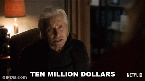 A Man Is Sitting In A Chair With The Words Ten Million Dollars Written On The Screen Behind Him GIF
