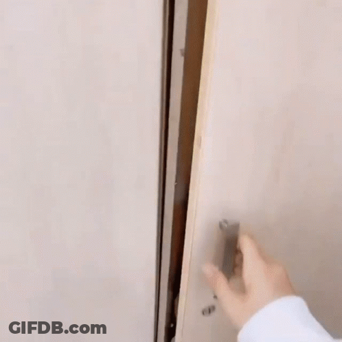 A Man Is Sitting In A Closet With His Head On A Woman 'S Lap . GIF