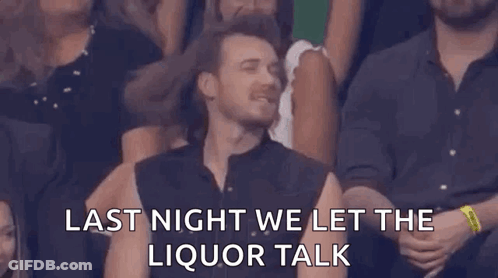 A Man Is Sitting In A Crowd Of People With His Eyes Closed And A Caption That Says `` Last Night We Let The Liquor Talk GIF