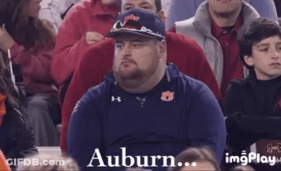 A Man Is Sitting In A Crowd With The Words Letting You Down Written On The Bottom GIF