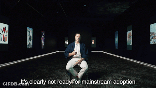 A Man Is Sitting In A Dark Room With The Words It 'S Clearly Not Ready For Mainstream Adoption GIF