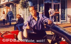 A Man Is Sitting In A Red Car And Says " Babe Wait " GIF