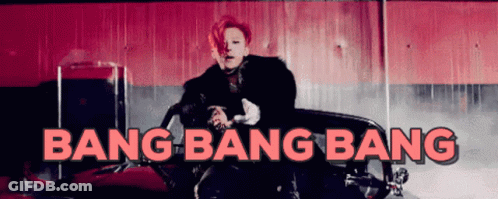 A Man Is Sitting In A Red Car With The Words Bang Bang Bang Above Him GIF