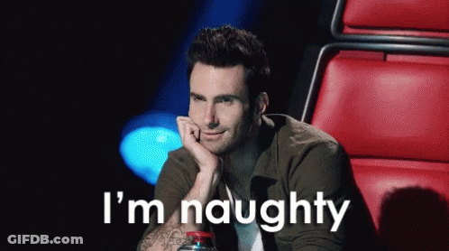 A Man Is Sitting In A Red Chair With His Hand On His Chin And The Words I 'M Naughty Behind Him . GIF