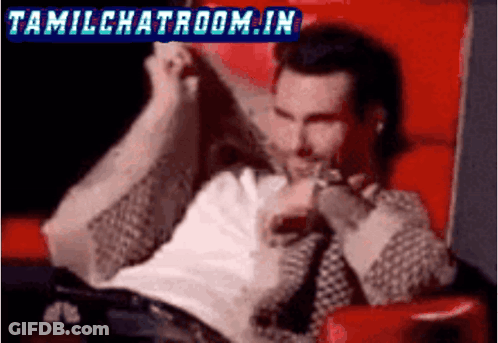 A Man Is Sitting In A Red Chair With The Words Tamilchatroom.in In The Corner GIF