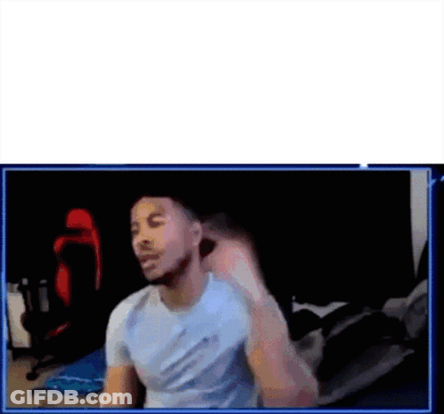A Man Is Sitting In Front Of A Computer Screen . GIF