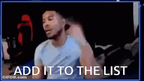 A Man Is Sitting In Front Of A Computer With The Words `` Add It To The List '' Written On The Screen . GIF