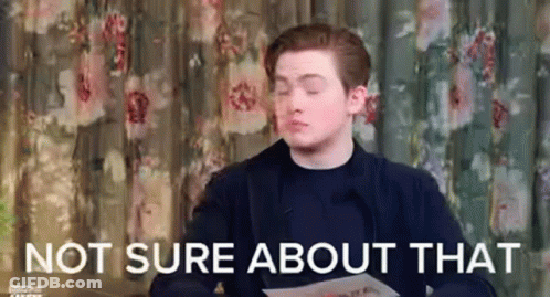 A Man Is Sitting In Front Of A Curtain And Holding A Piece Of Paper With The Words `` Not Sure About That '' . GIF