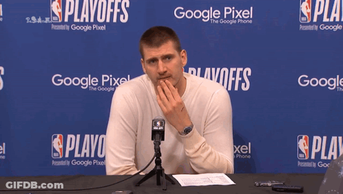 A Man Is Sitting In Front Of A Google Pixel Banner GIF