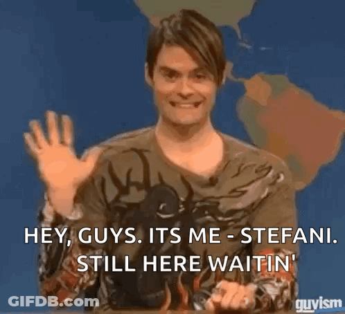 A Man Is Sitting In Front Of A Map Of The World And Waving His Hand . GIF