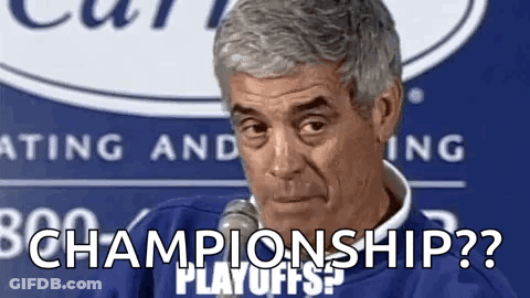 A Man Is Sitting In Front Of A Microphone And Saying `` Championship ? '' . GIF