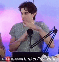 A Man Is Sitting In Front Of A Microphone With The Words Jon - Thinker / Rek ' Niht Above Him GIF