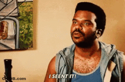 A Man Is Sitting In Front Of A Painting And Says `` I Seen It '' . GIF