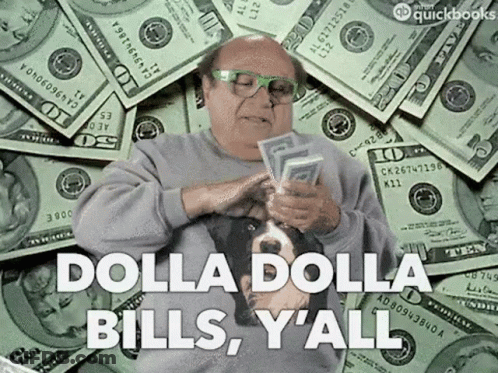 A Man Is Sitting In Front Of A Pile Of Money And Holding A Bunch Of Money In His Hands . GIF