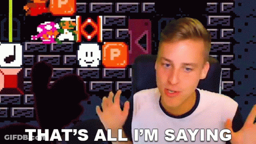 A Man Is Sitting In Front Of A Screen That Says That 'S All I 'M Saying . GIF