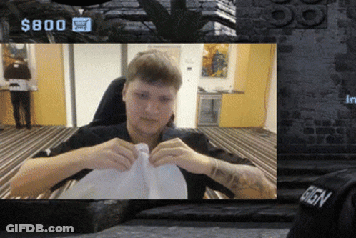A Man Is Sitting In Front Of A Sign That Says $ 800 On It GIF