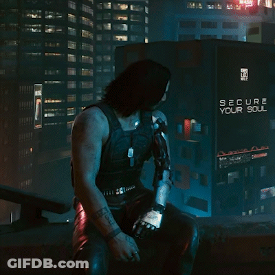 A Man Is Sitting In Front Of A Sign That Says Secure Your Soul GIF