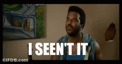 A Man Is Sitting In Front Of A Wall With A Painting On It And The Words `` I Seen It '' Written On It . GIF