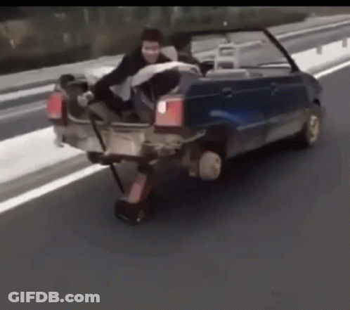 A Man Is Sitting In The Back Of A Blue Car GIF