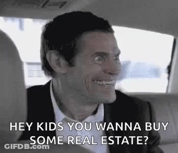 A Man Is Sitting In The Back Seat Of A Car And Smiling . GIF