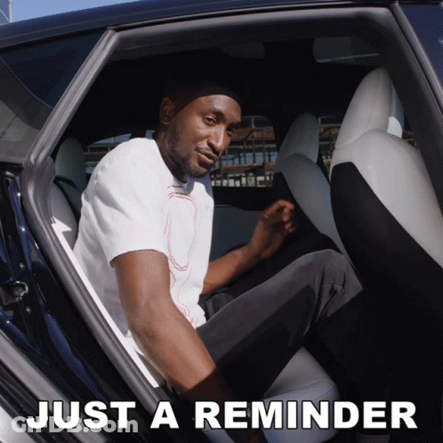 A Man Is Sitting In The Back Seat Of A Car And The Words Just A Reminder Are Above Him GIF