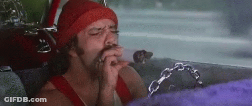 A Man Is Sitting In The Back Seat Of A Car Smoking A Cigarette And Drinking A Beer . GIF