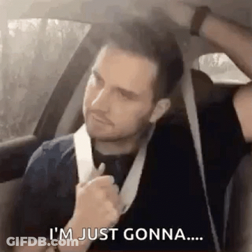A Man Is Sitting In The Back Seat Of A Car With A Bandage On His Neck . GIF