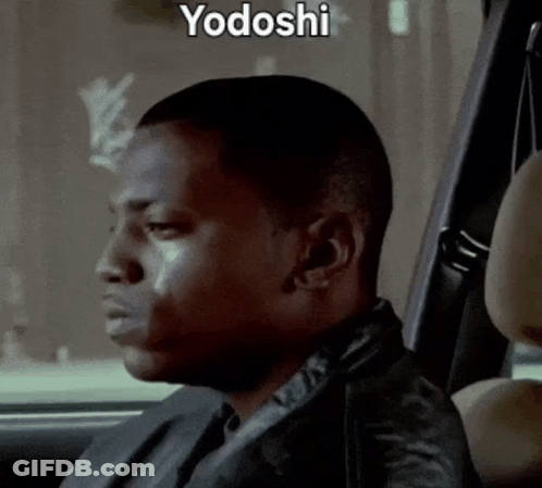 A Man Is Sitting In The Back Seat Of A Car With Yodoshi Written On The Bottom GIF