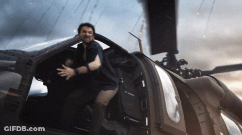 A Man Is Sitting In The Cockpit Of A Helicopter That Says U.s. Air Force On It GIF
