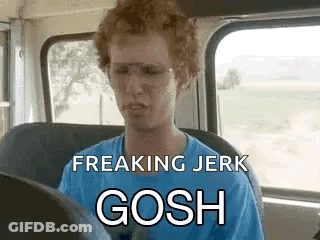 A Man Is Sitting In The Driver 'S Seat Of A Bus With Glasses On . GIF