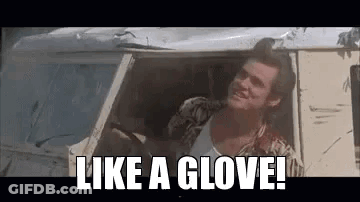 A Man Is Sitting In The Driver 'S Seat Of A Car And Says `` Like A Glove '' . GIF