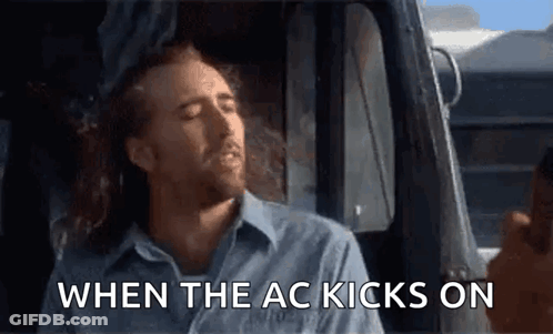 A Man Is Sitting In The Driver 'S Seat Of A Truck And Says When The Ac Kicks On GIF