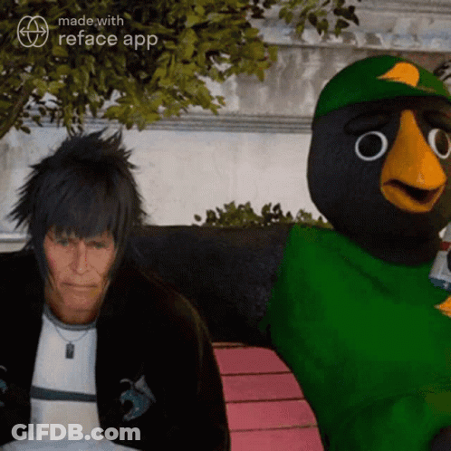 A Man Is Sitting Next To A Cartoon Bird With The Words Made With Reface App On The Bottom GIF