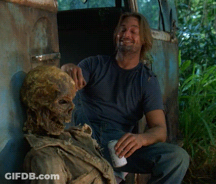 A Man Is Sitting Next To A Skeleton And Holding A Can Of Beer GIF