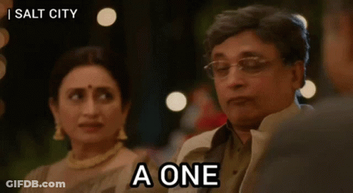 A Man Is Sitting Next To A Woman And Says A One GIF