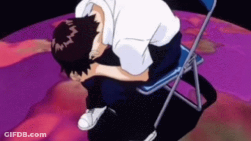 A Man Is Sitting On A Chair With His Head Down And His Eyes Closed . GIF