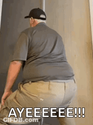 A Man Is Sitting On A Chair With The Words Ayeeeee Written On The Bottom Of His Butt . GIF